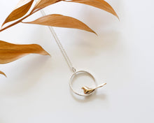 Load image into Gallery viewer, Handcrafted Bronze Bird Necklace with Textured Sterling Silver Circle Pendant
