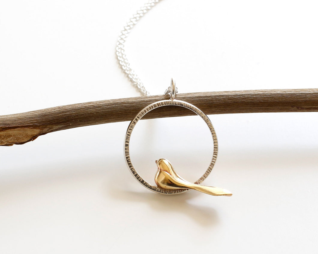 Handcrafted Bronze Bird Necklace with Textured Sterling Silver Circle Pendant